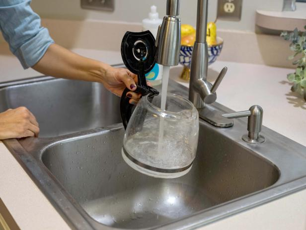 pouring water in the coffee pot
