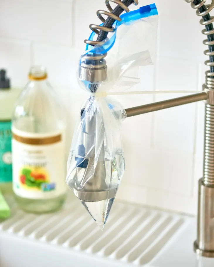 kitchen faucet head soaked in vinegar 
