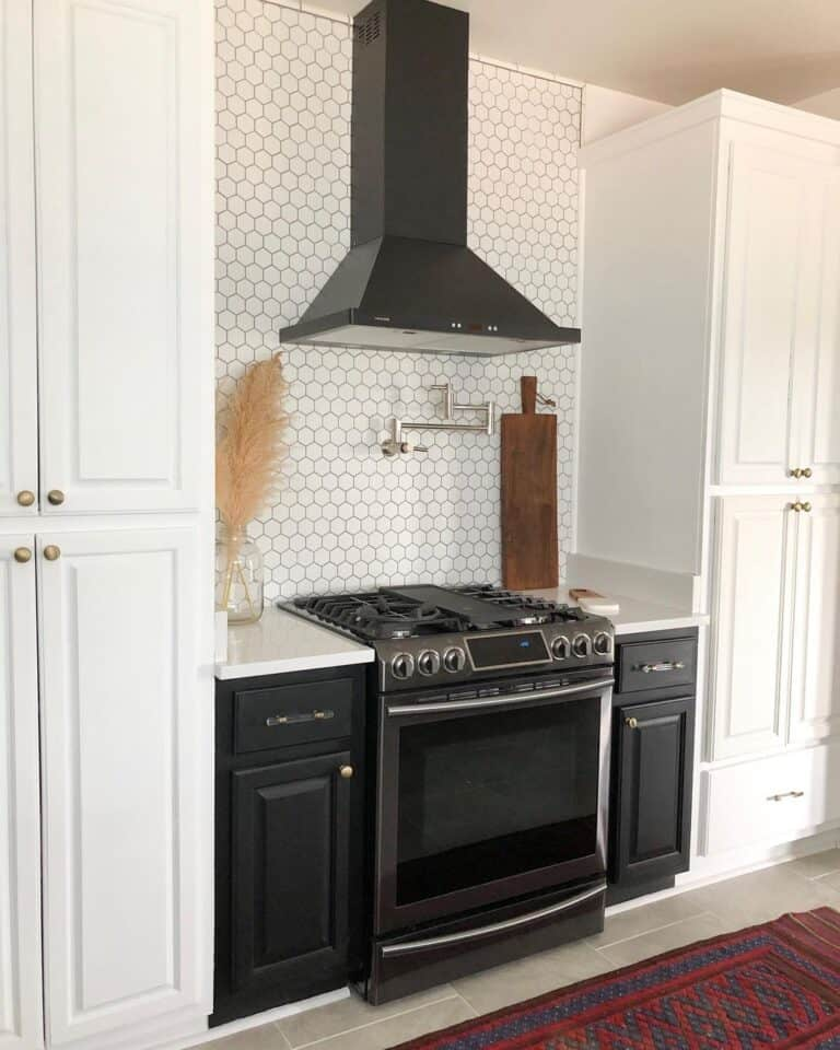 Black kitchen cabinets with black range hood
