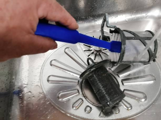 cleaning whirlpool dishwasher filter with brush