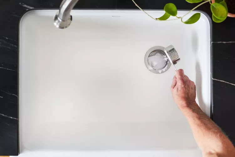 Cleaning kitchen sink drain with baking soda