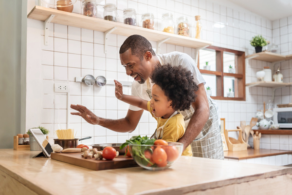 Father and son working together in the kitchen