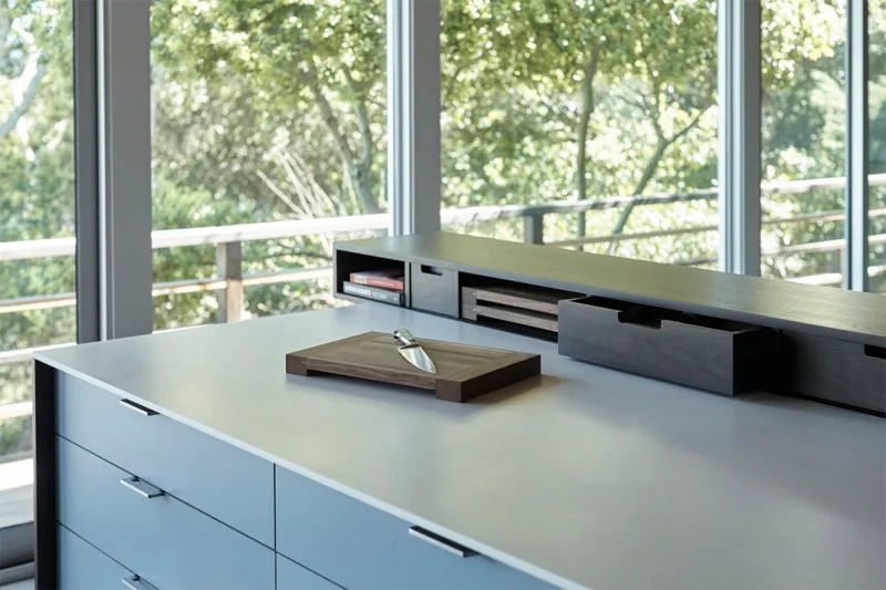 cutting board placed on a kitchen counter
