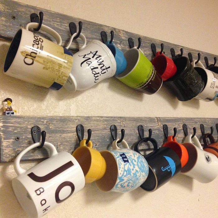 coffee mugs hanged on a kitchen wall